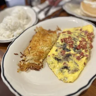 Omelette with hash browns and side rice of course