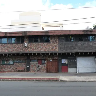 a brick building on a street corner