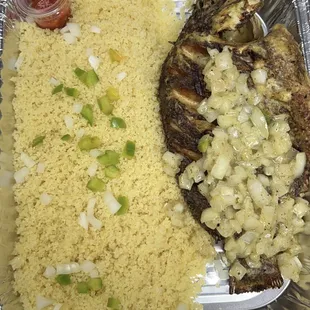 a meal of fish, rice and vegetables