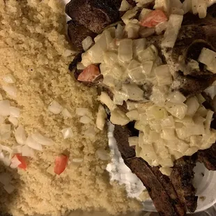 a plate of food with meat and rice