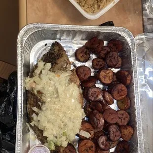 a tray of food and a container of rice