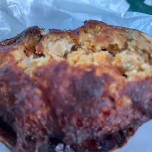 a piece of bread on a piece of wax paper