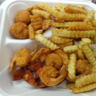 Fried scallops &amp; shrimp with French fries and hush puppies.
