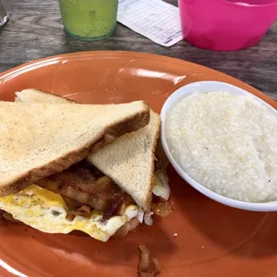 Bacon, egg and cheese sandwich with grits.