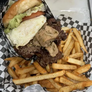 FUSION burger egg OH, gauc, lettuce, tomato, cheese, and chili verde