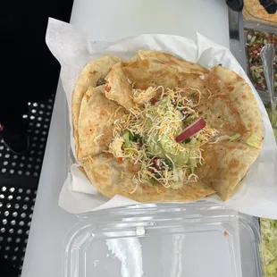 a tortilla in a plastic container