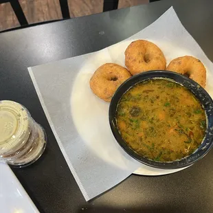 Vada sambar, peanut butter, chutney, coconut chutney, and tomato chutney