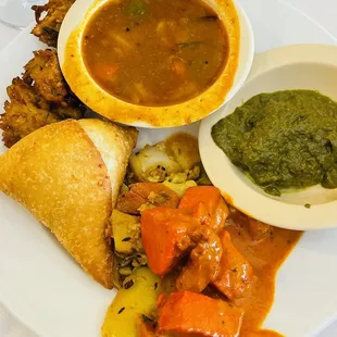 Sambar, samosa, paneer curry.