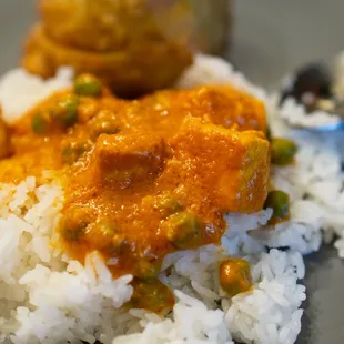 a plate of rice and tofu