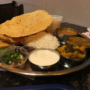 a plate of indian food on a table