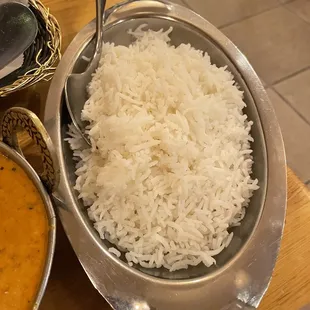 a bowl of rice and a bowl of curry