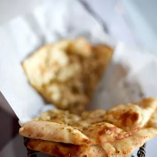 two pieces of pizza in a basket