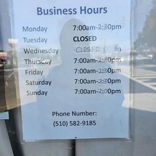 Business Hours Taped To The Front Door