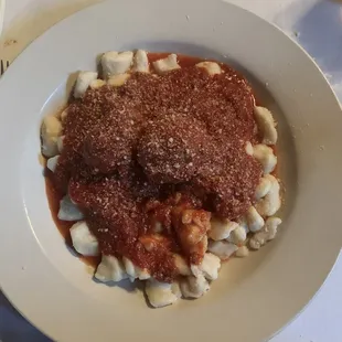 Gnocchi and meatballs in meat sauce