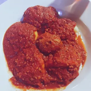 Pillowy Cheese ravioli with one meatball.