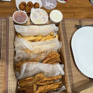 a box of fried fish and fries