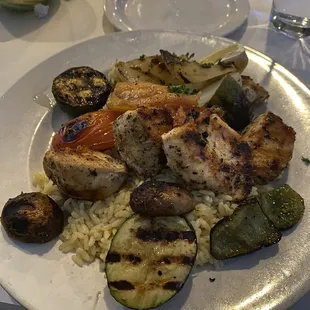Chicken Kabobs - all white meat chicken with mushrooms, zucchini, tomatoes, and onions over a bed of rice.