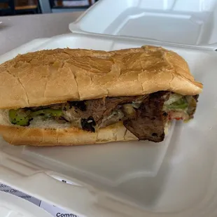 a sandwich in a styrofoam container