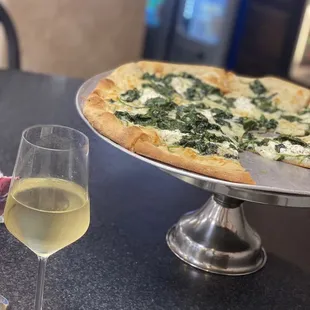 Amazing white pizza with fresh spinach.