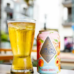 a can and a glass on a table