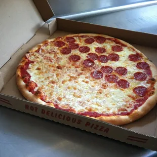 a pepperoni pizza in a box
