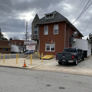 a truck parked in front of a building