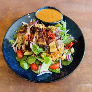 Newest creation! Grilled Halal chicken salad with creamy peanut sauce dressing.