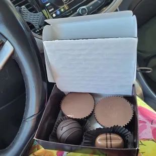 Two peanut butter cups.  A 72% cocoa truffle called 'decadant' , and a milk chocolate espresso truffle.