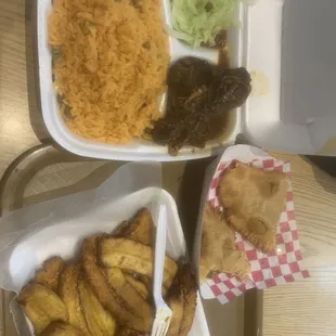 Fried plantains, beef and cheese empanada and chicken with rice.