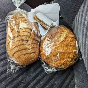 two loafs of bread wrapped in plastic