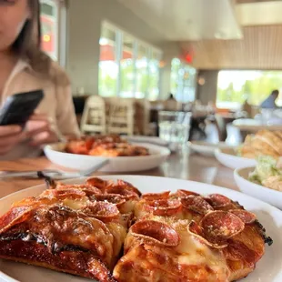 a slice of pizza on a plate