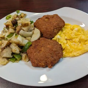 Home fries, salmon patties and scrambled eggs