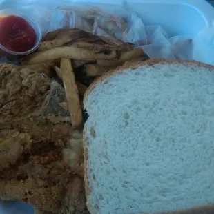 Pork Chop and fries with white bread. You can't see it, but there are 10 wing dings underneath...