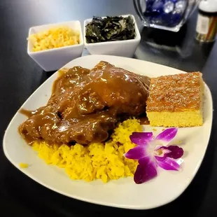 Smothered Pork Chops over Yellow Rice