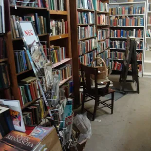 A seller in back with a ton of vintage and antique books!
