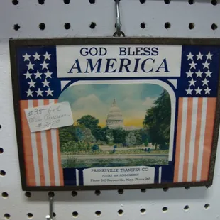 A small patriotic advertising wall hanging - looks like 1940s era.