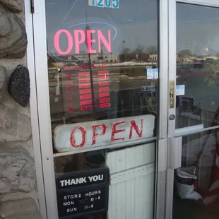 Hours of operation, front entry door.