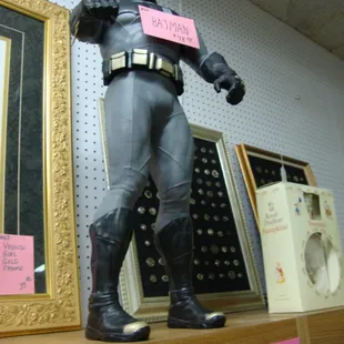 A large 2 or 3 foot vintage batman, looking down on the customers!  :-)