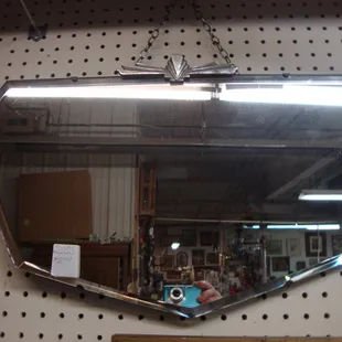 A classy looking antique art deco wall mirror.
