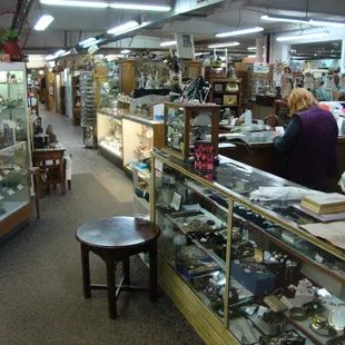 View looking inside at the front entryway, front desk &amp; register on the right.