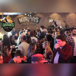 a crowd of people at a bar