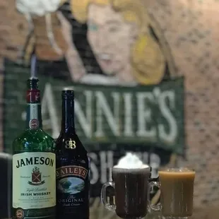 two glasses of irish coffee and a bottle of jameson