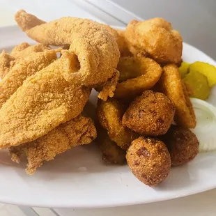 Fried fish with hush puppies, fries or onion rings