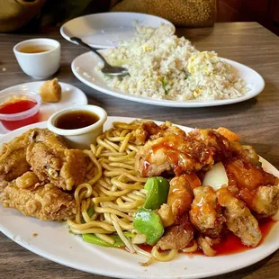 Lunch Combo (Sichuan Chicken, Sweet &amp; Sour Pork, Chow Mein, Eggroll) Background: Salted Fish &amp; Chicken Fried Rice