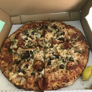 Slightly unbalanced large supreme pizza