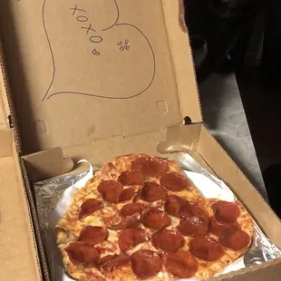 a pepperoni pizza in a box