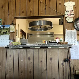 a counter with a clock above it