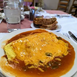 Annie&apos;s omelet (chopped green chile and grilled ham in a three-egg omelet smothered in red chile and cheese) - and rye toast!