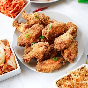 a plate of fried chicken wings
