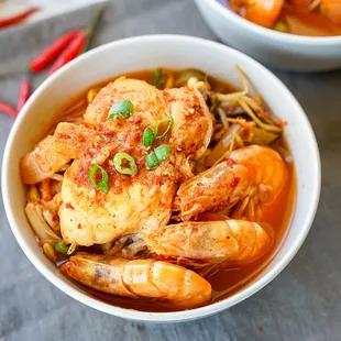 a bowl of shrimp and noodles